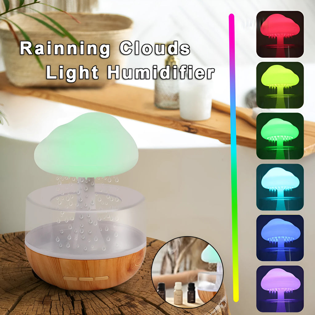 White raining cloud humidifier with night light and essential oil diffuser on table