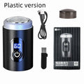 Black mini portable USB rechargeable electric shaver with cleaning brush and cable.