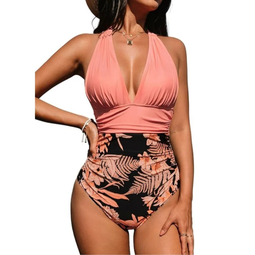 Women's black halter neck one-piece swimsuit on a mannequin, showcasing the backless design