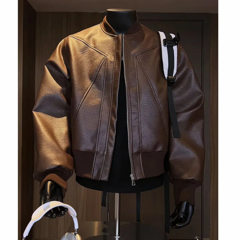 Men's black PU leather jacket with litchi grain texture, showing extended 100cm length and tight fit.