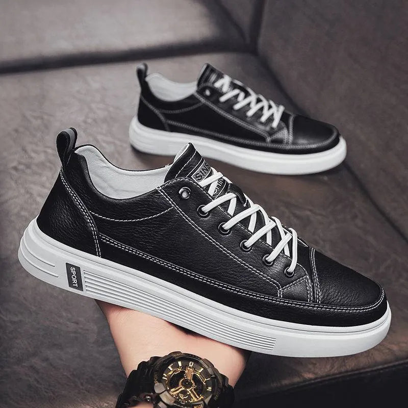 Men's white casual shoes with round toe, flat bottom, and shallow opening design