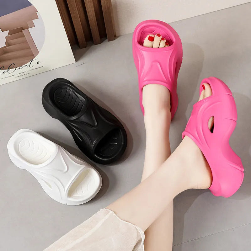 Women's thick-soled EVA slippers in rose red colour showing round toe design