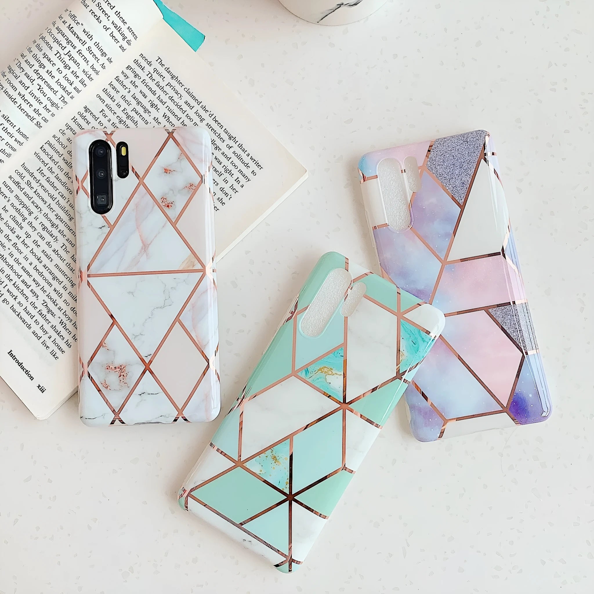 Electroplated marble pattern mobile phone case for Huawei and Samsung smartphones in various colours.