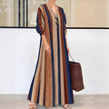 Camel coloured vertical striped V-neck long dress with A-line skirt and long sleeves.