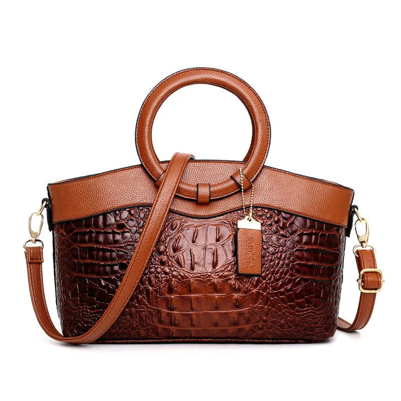 Fabric ladies handbag showing multiple compartments including phone and ID sections