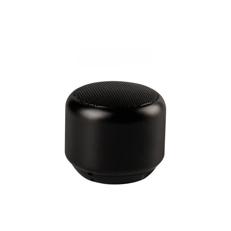 A compact portable Bluetooth mini speaker in black, blue, gold, or pink colour.