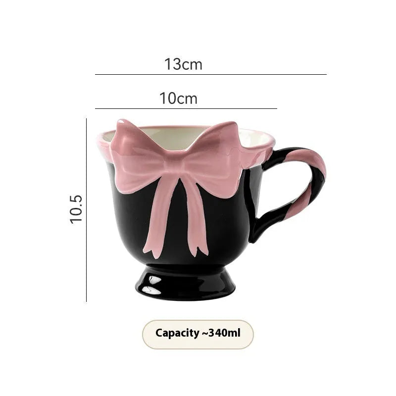Ceramic mug with heart bow design in Black Pink colour, 301-400ml capacity.