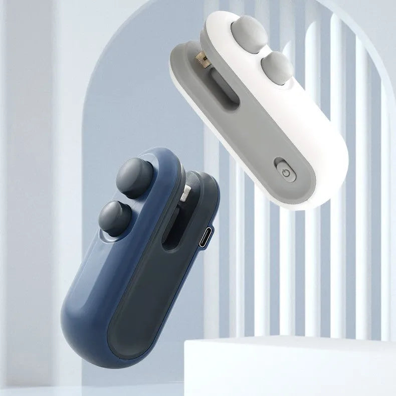 Blue and white handheld USB rechargeable food sealer with magnetic back and cutter blade.