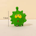 Four colourful squeaky dog balls with cute faces made from natural latex rubber with textured surfaces