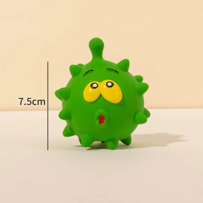 Four colourful squeaky dog balls with cute faces made from natural latex rubber with textured surfaces