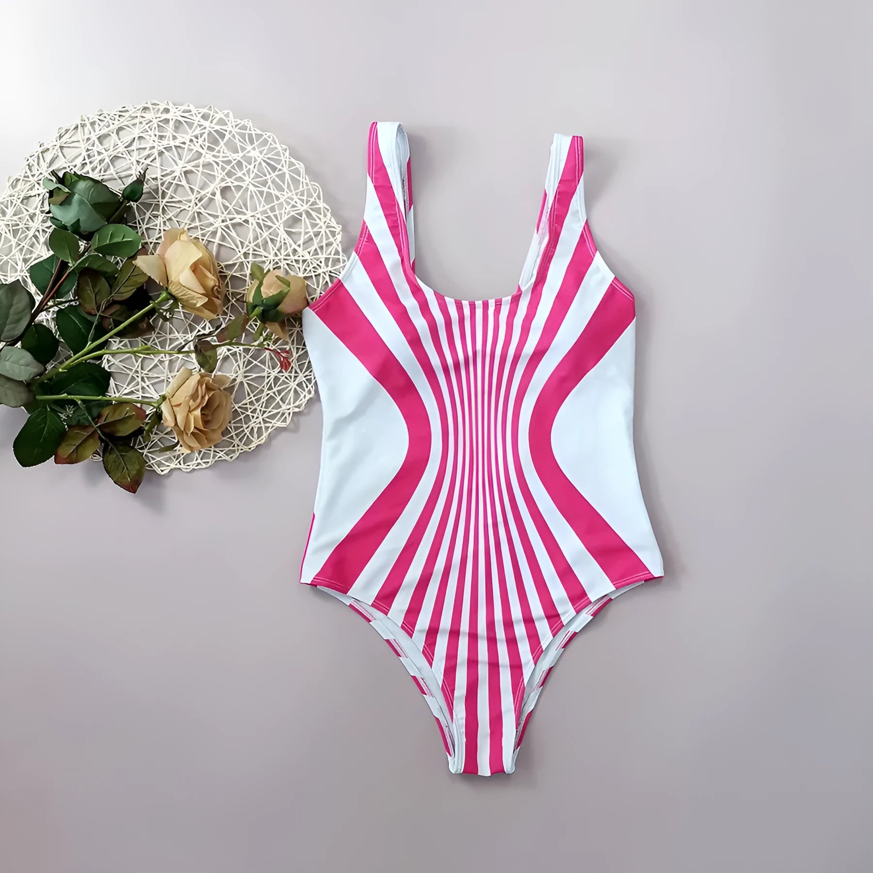 Women's pink striped one-piece swimsuit with digital print on front and back.
