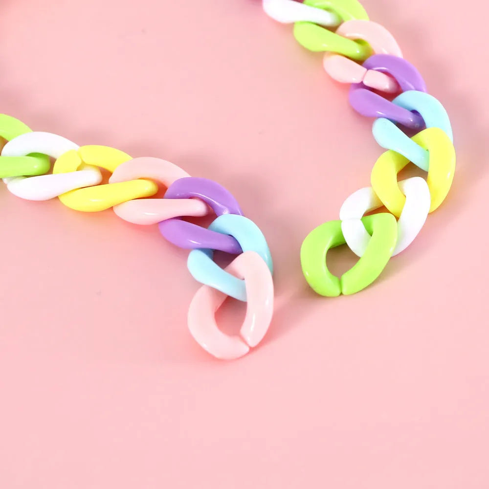 Macaron candy coloured plastic pet collar for cats, dogs, and rabbits in chain blue, pink, and mixed colours on a white background.