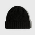 Women's wool knitted dome winter hat with a textured totem pattern.
