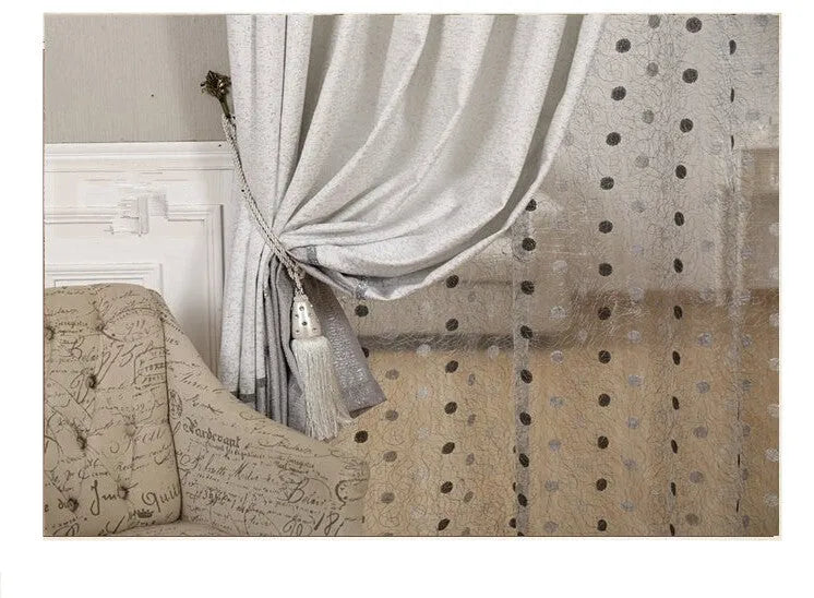 Simple blackout curtain panel hanging, showing light-blocking fabric and hook heading style.