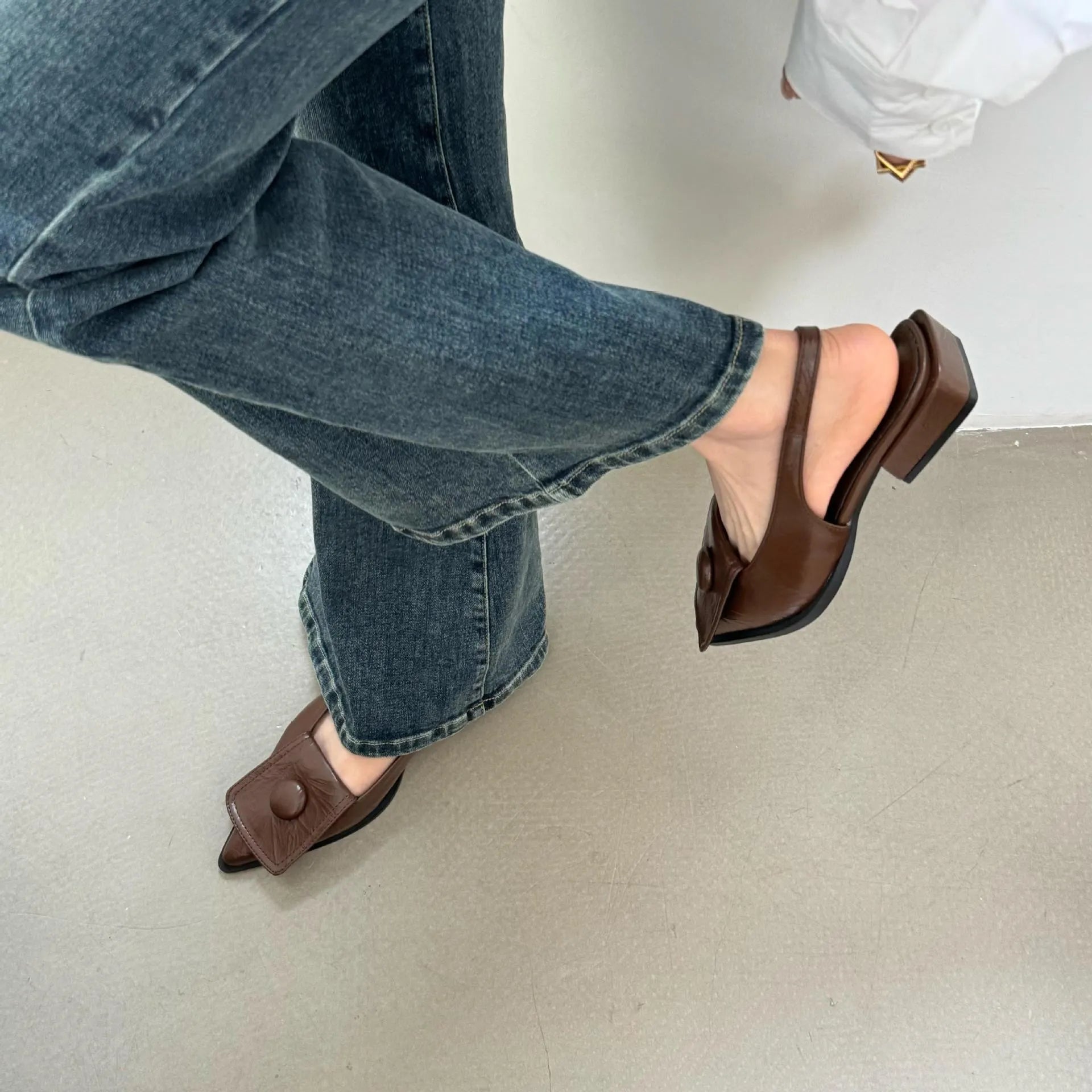 Women's low heel pointed toe sandals with back strap in apricot, black, brown, and silver colours.