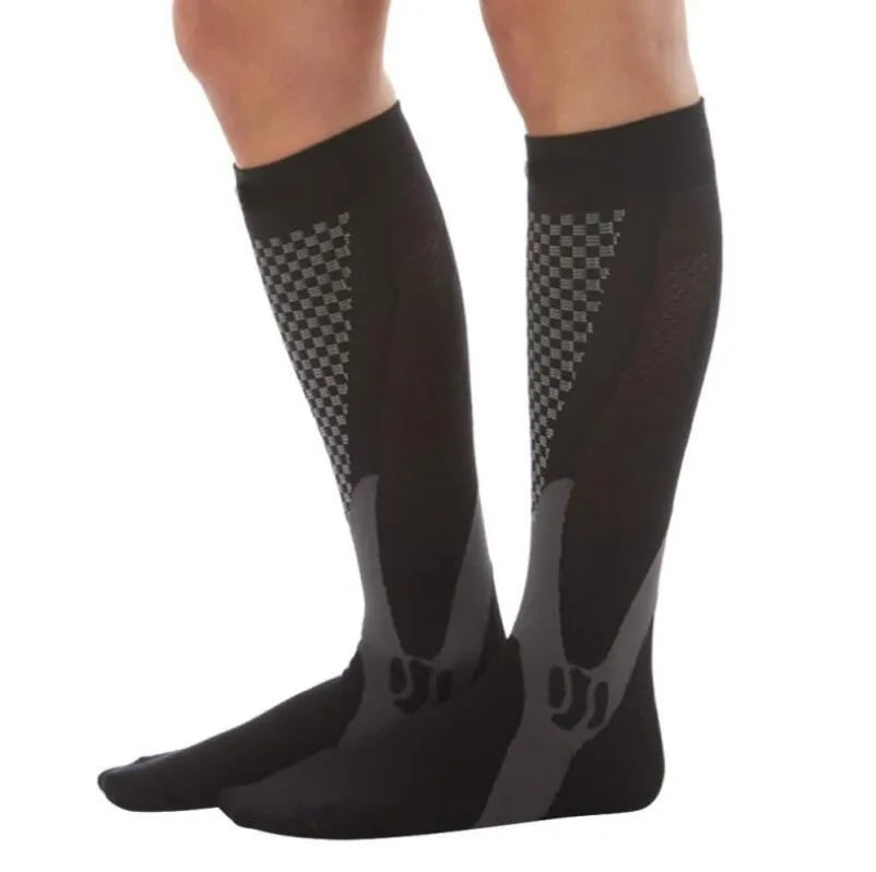 Athletic fit graduated compression socks for men and women in black, shown on a leg.
