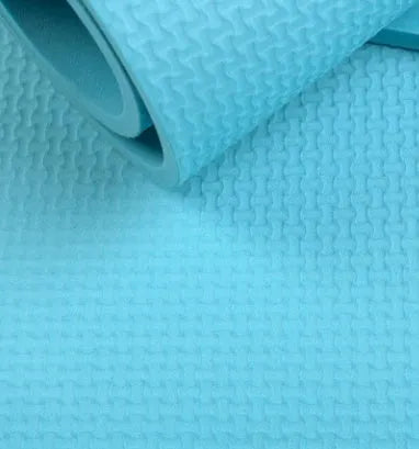 Super soft EVA yoga mat in blue showing texture and thickness