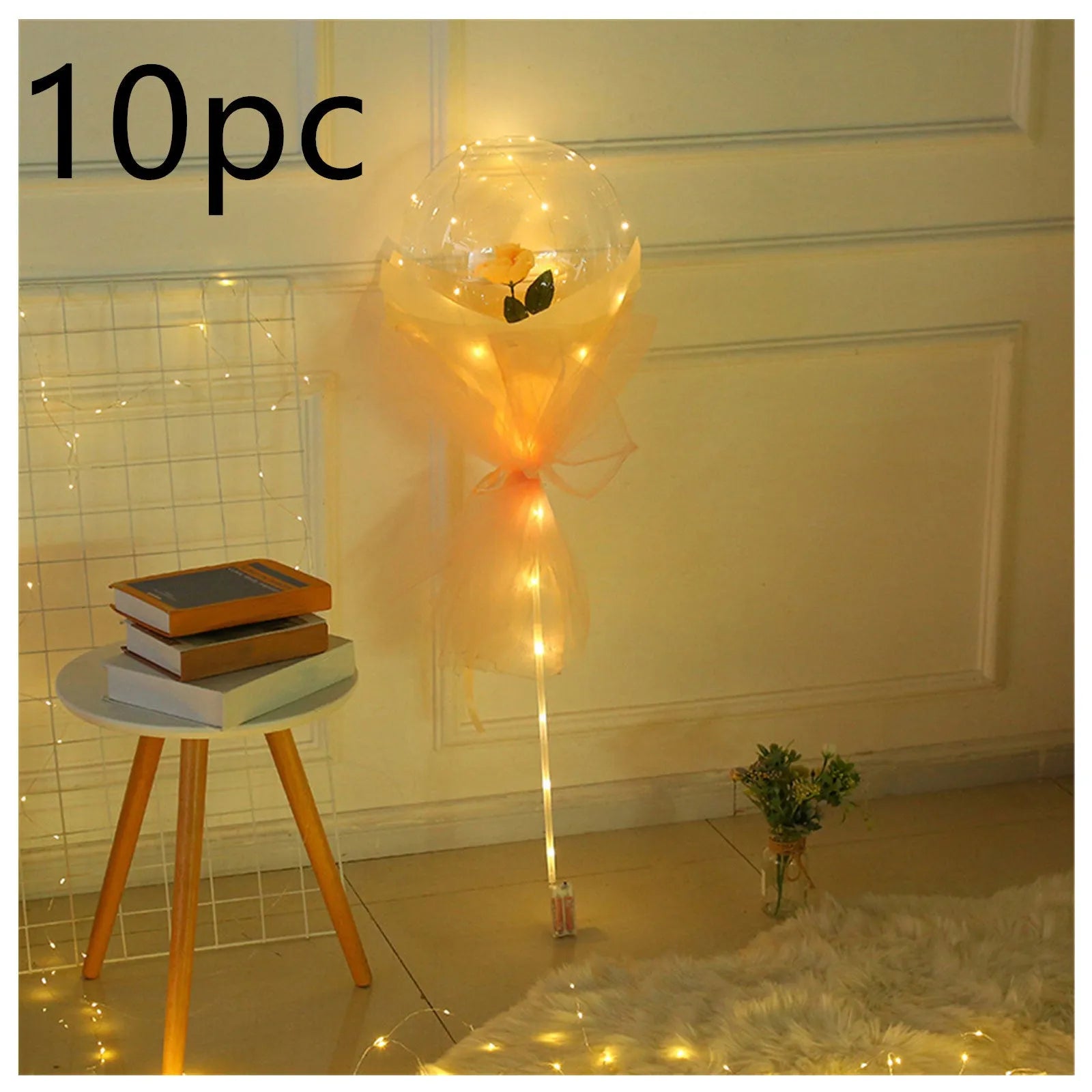 Transparent LED luminous balloon bouquet with artificial rose and glowing light inside, displayed as a DIY kit.