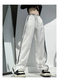 Women's slim-fit drape trousers in thin fabric with low waist and straight leg