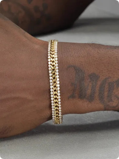 Gold-coloured tennis bracelet with gemstone detail on a titanium steel band.