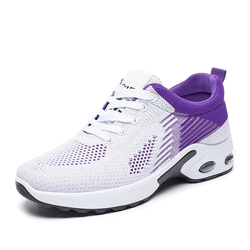 Women's pink Flyknit casual running shoes with mesh lining and flat heel on a white background