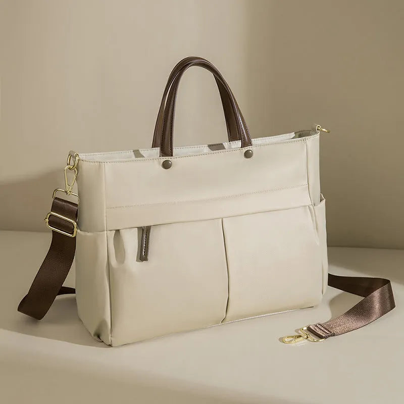 Portable oxford cloth laptop briefcase for women in elegant black with contrast stitching and large capacity.