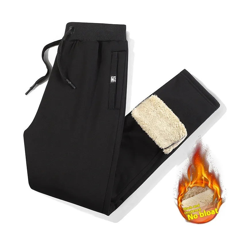 Men's grey fleece-lined oversized cotton track pants with an elastic mid-waist.