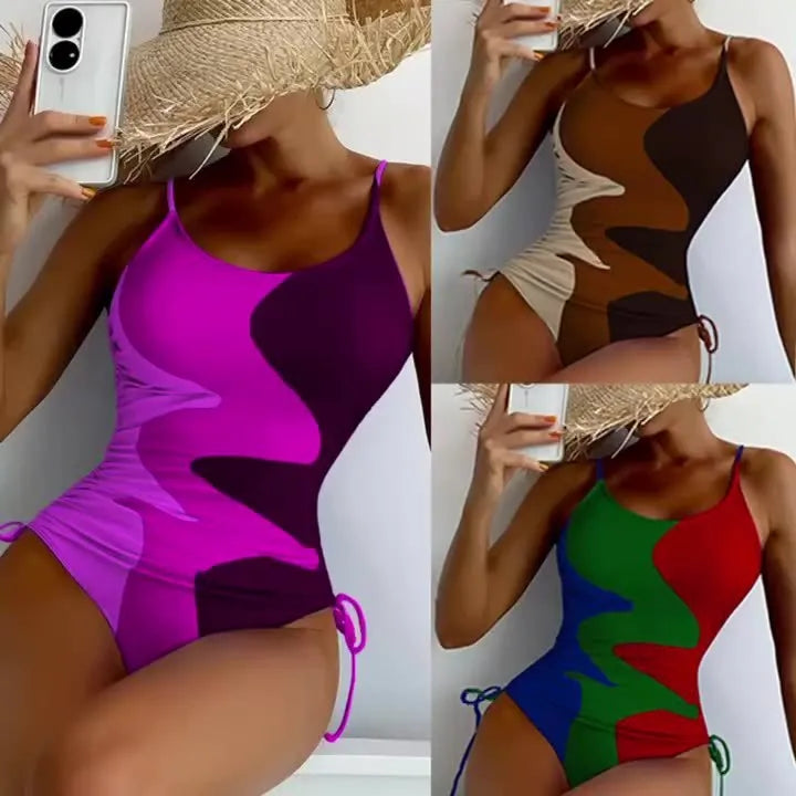 Women's sleeveless backless one-piece swimsuit in blue, shown on a mannequin.