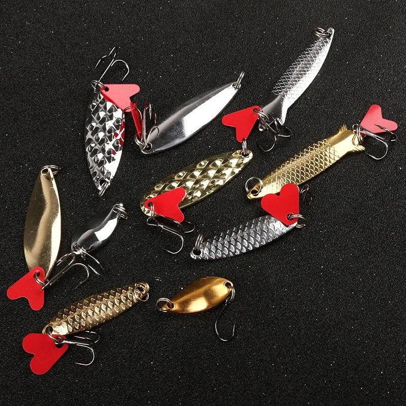 Pineapple-shaped iron fishing lure covered in gold and silver metal sequins.