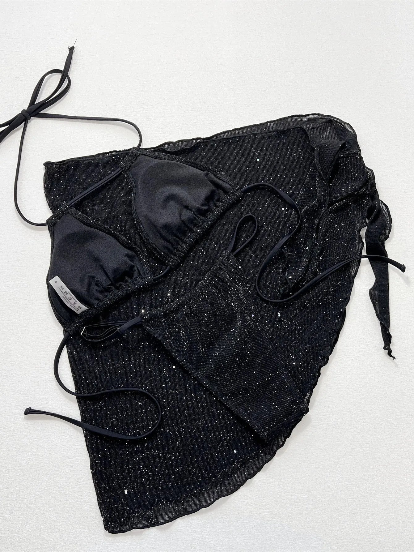 Black three-piece swimsuit bikini set with separate top and shorts