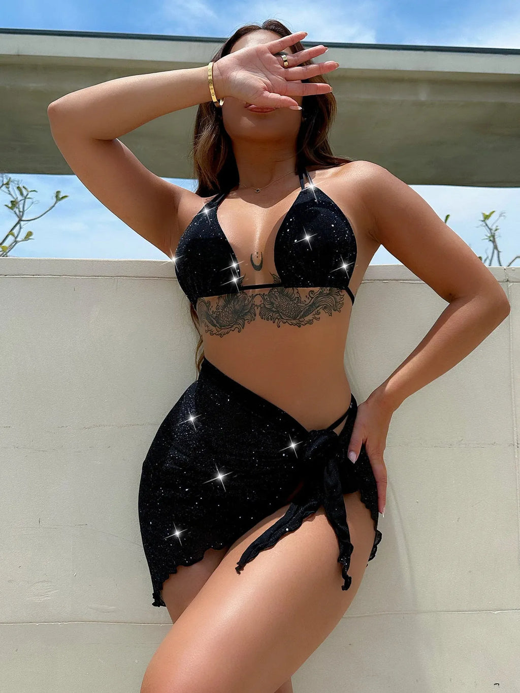 Black three-piece swimsuit bikini set with separate top and shorts