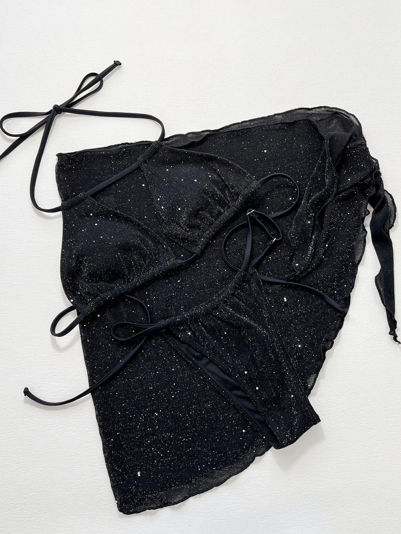 Black three-piece swimsuit bikini set with separate top and shorts