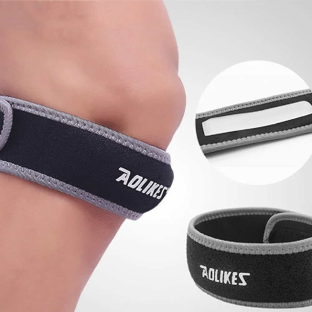 Black and grey adult patella retinaculum knee support bandage for sports.