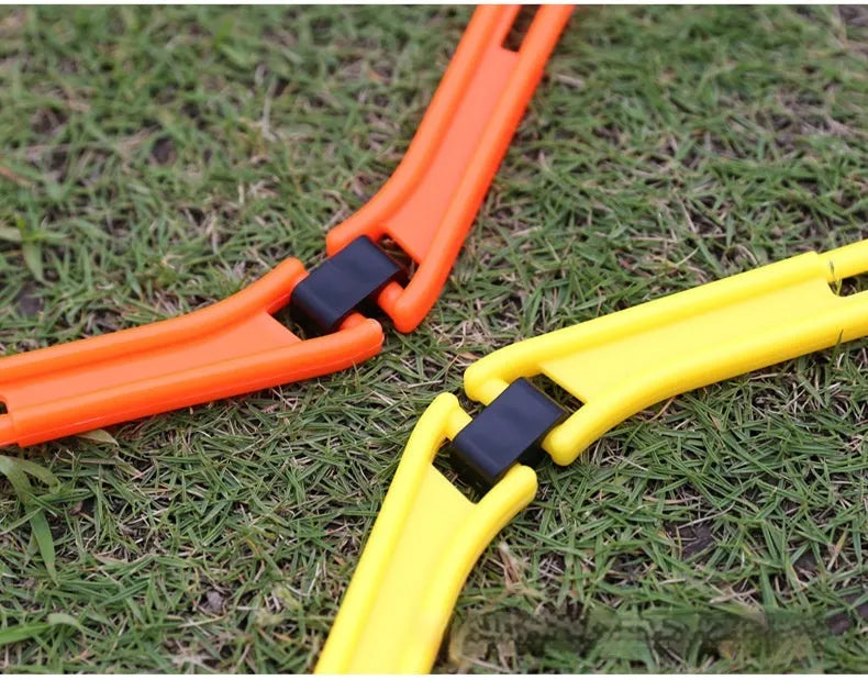 Set of six foldable yellow, green, and orange hexagon plastic agility rings for football training.