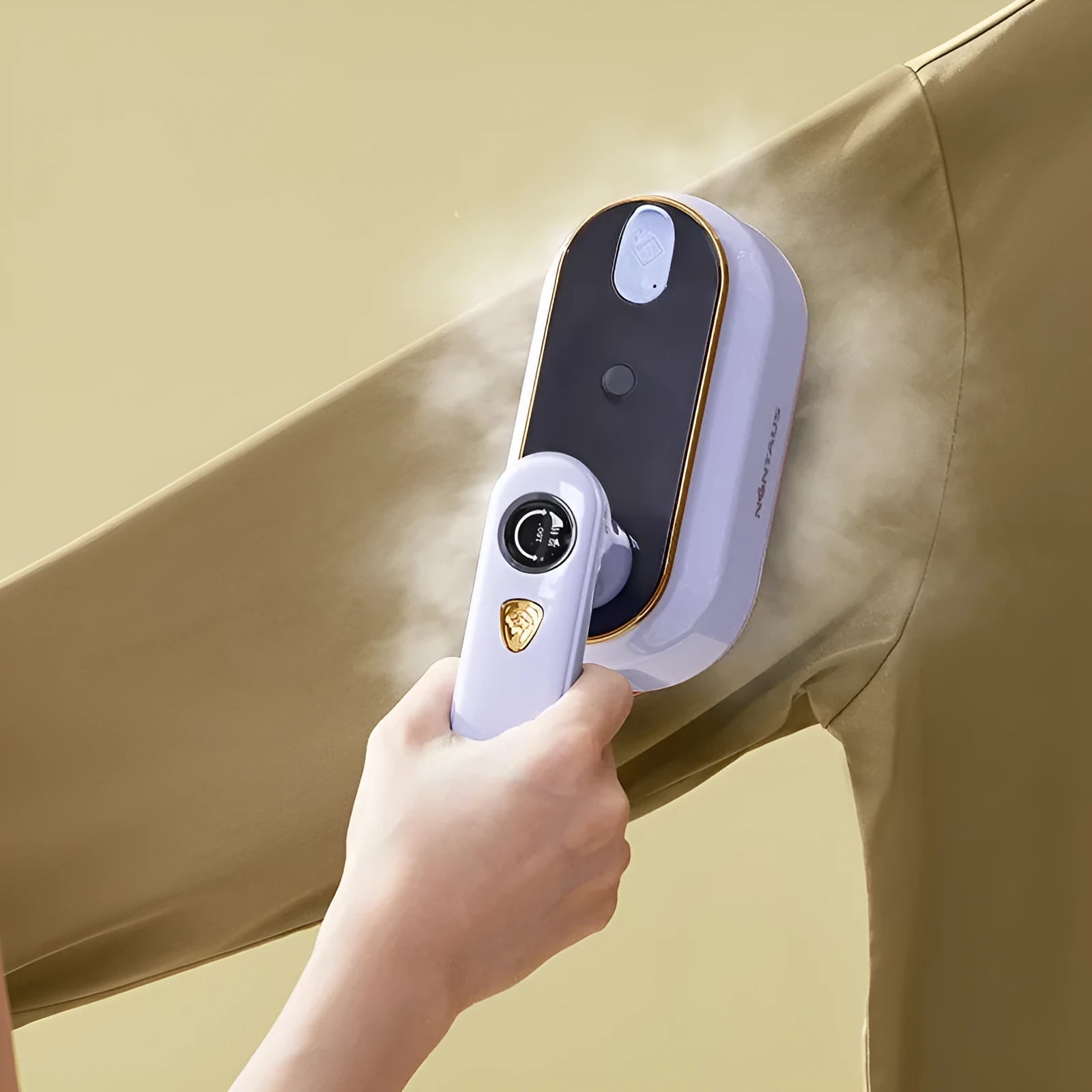 Foldable portable travel iron with ceramic base plate in light purple colour showing dual voltage rating