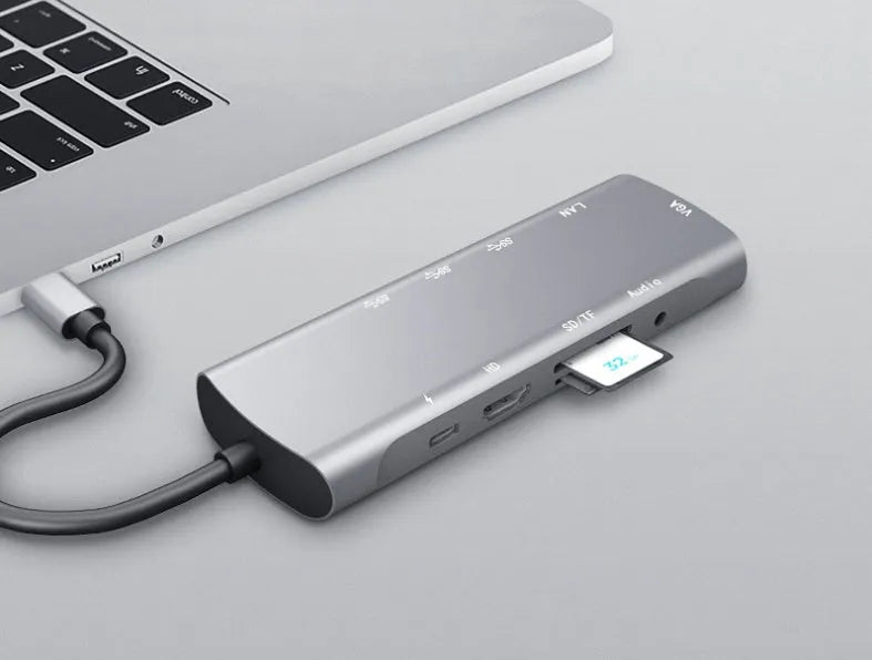 Grey aluminium USB-C docking station with HDMI, VGA, USB and charging ports