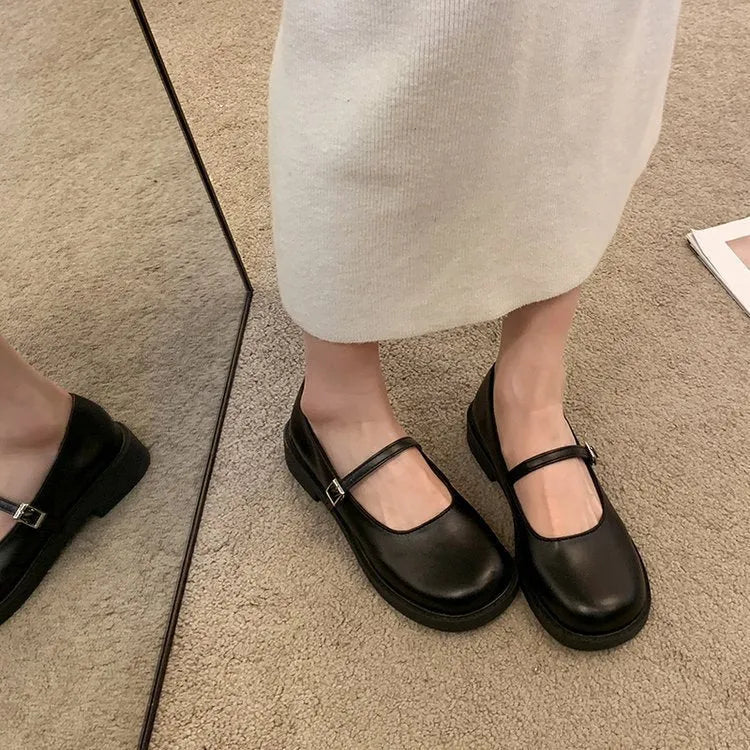 Women's solid colour flat heel loafers in red, black, or greyish black.