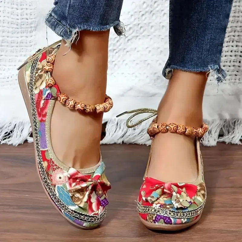 Women's black ethnic style platform sandals with elastic band closure, fabric upper, and round toe.
