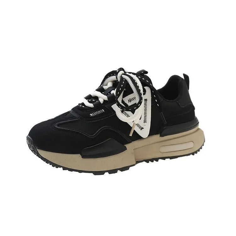 Women's black retro platform sports shoes with round toe and lace-up design on a white background.