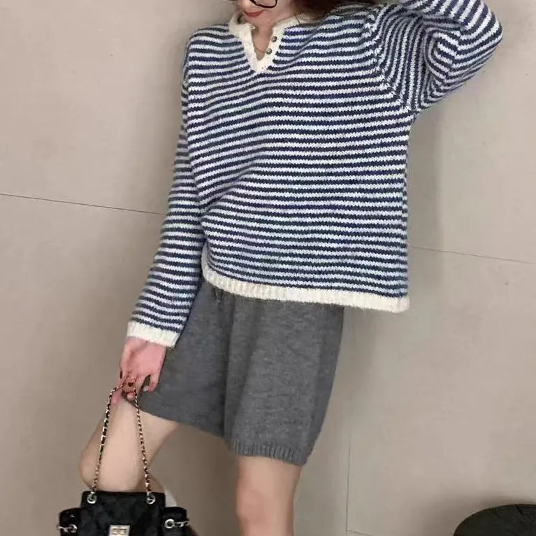 Red and blue striped cashmere pullover sweater for women with loose fit and long sleeves.