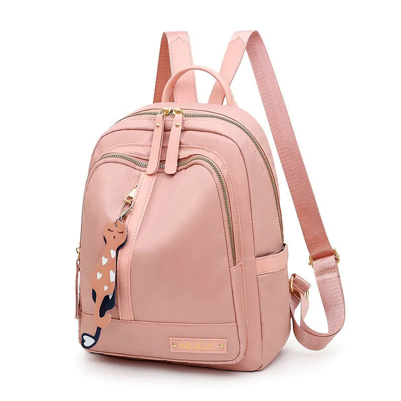 Women's black nylon backpack with waterproof lining and multiple zippered compartments