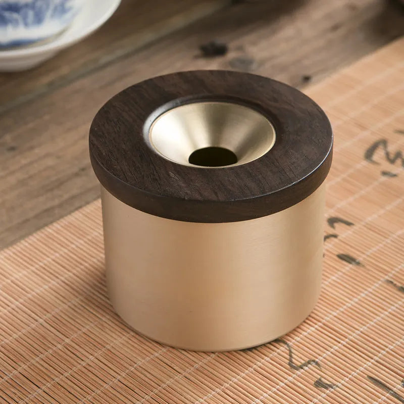 Retro-style solid copper ashtray with a wooden lid in black or red.