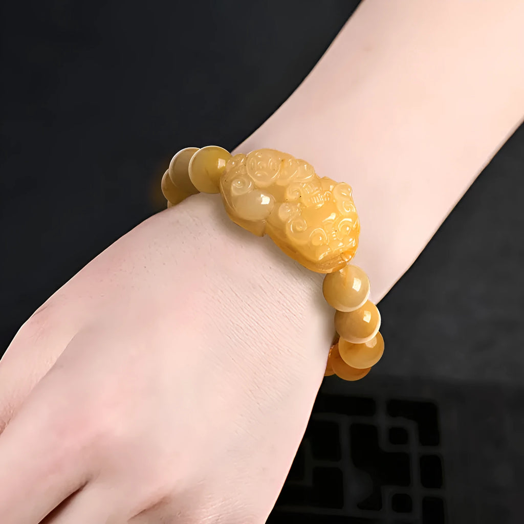 Carved Jinsi Jade money bracelet showing golden thread patterns in natural stone