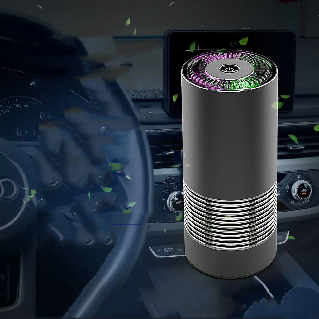 Compact cylindrical car air purifier in metallic grey with aluminium alloy casing.