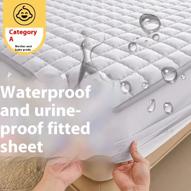 Blue washed cotton waterproof fitted sheet with elasticated corners shown on mattress