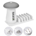 White mushroom-shaped USB charging dock station with five ports and a glowing LED light on a desk.