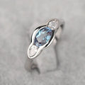 Geometric ellipse ring with zircon inlay in white gold colour on copper