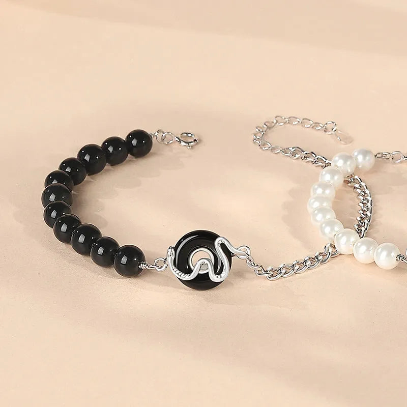 New Chinese style snake zodiac bracelet in 925 sterling silver with a peace buckle clasp, shown in male and female variants.