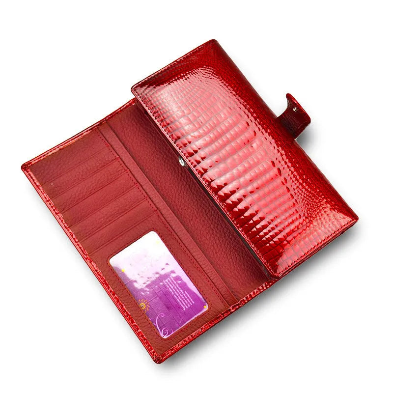 Women's leather coin purse with crocodile pattern texture in red colour showing pigskin lining