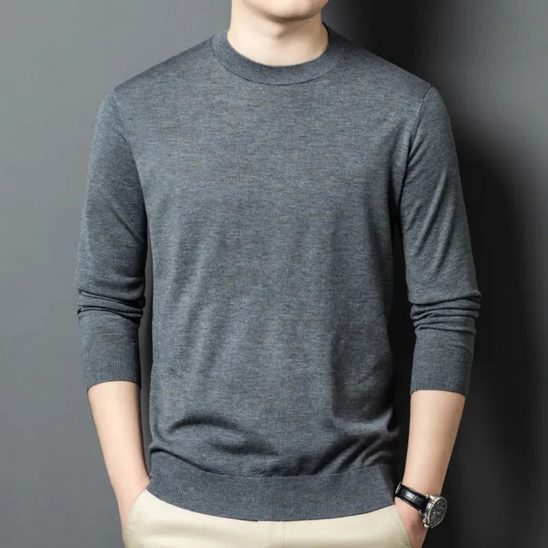 Men's round neck grey wool blend pullover sweater with long sleeves on a hanger.